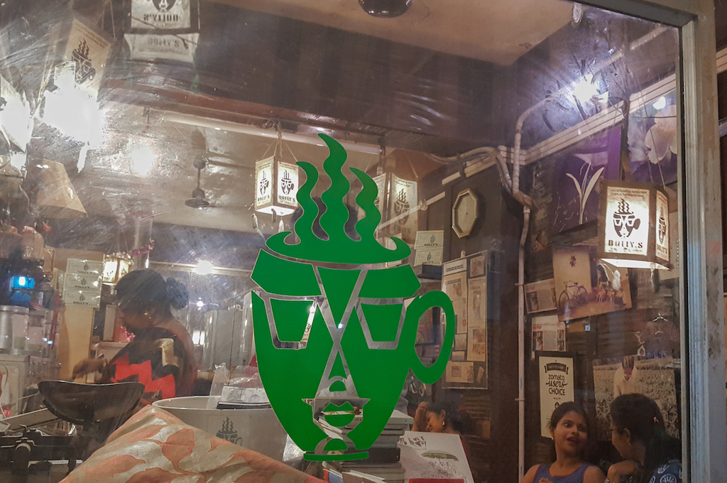 Green window mark of a cartoon coffee cup