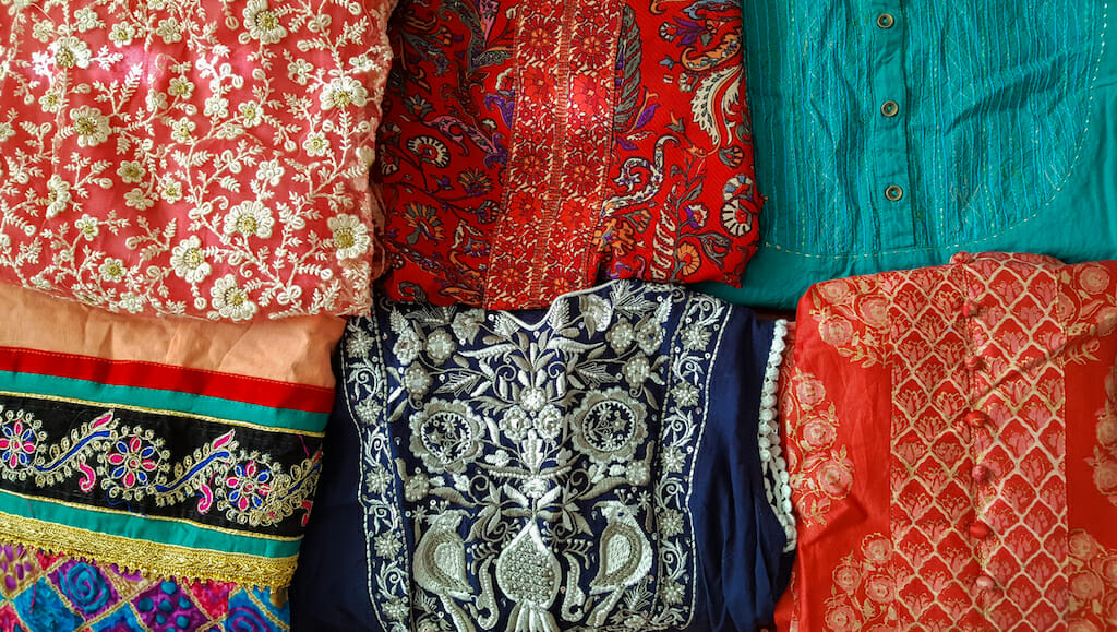 Colorful frabrics of multiple colors and patterns on display at Kolkata markets